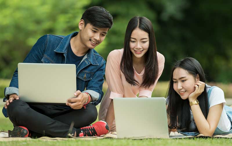 student studying outside