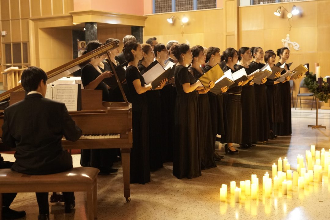 A group of singers doing a performance at a Candlelight Concert hosted by Laureate College in Burlington, Ontario